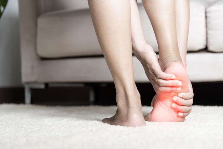 pain in plantar foot indicated by redness highlighted on the right foot, possibly caused by impingement