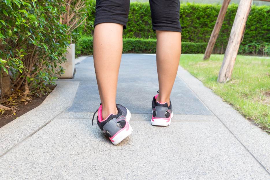 woman inverting left foot while walking possibly causing an ankle sprain